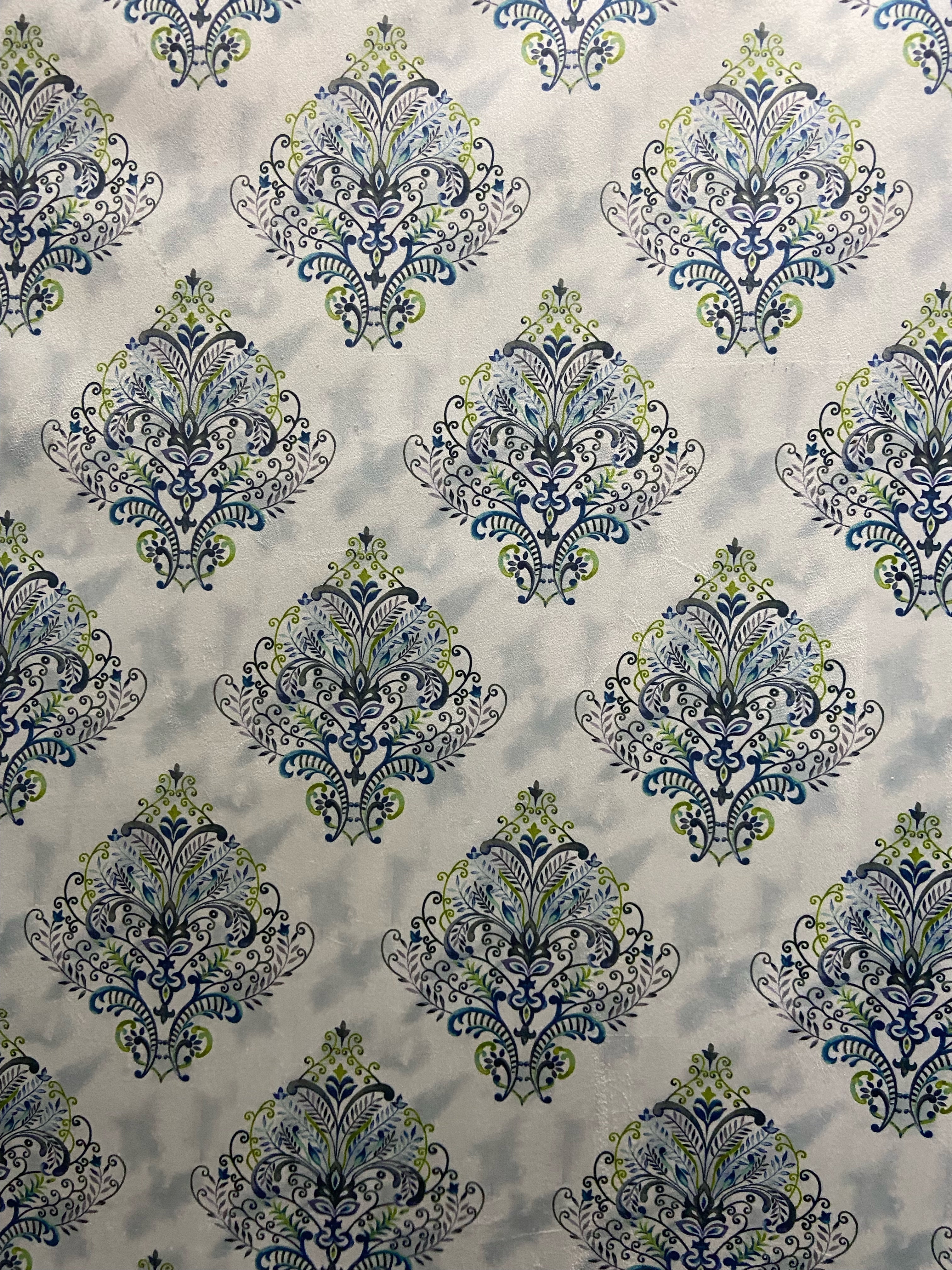 Decorative fabric pattern with Blue designs on a taupe background