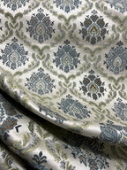 Decorative fabric with intricate Blue floral pattern on a beige background