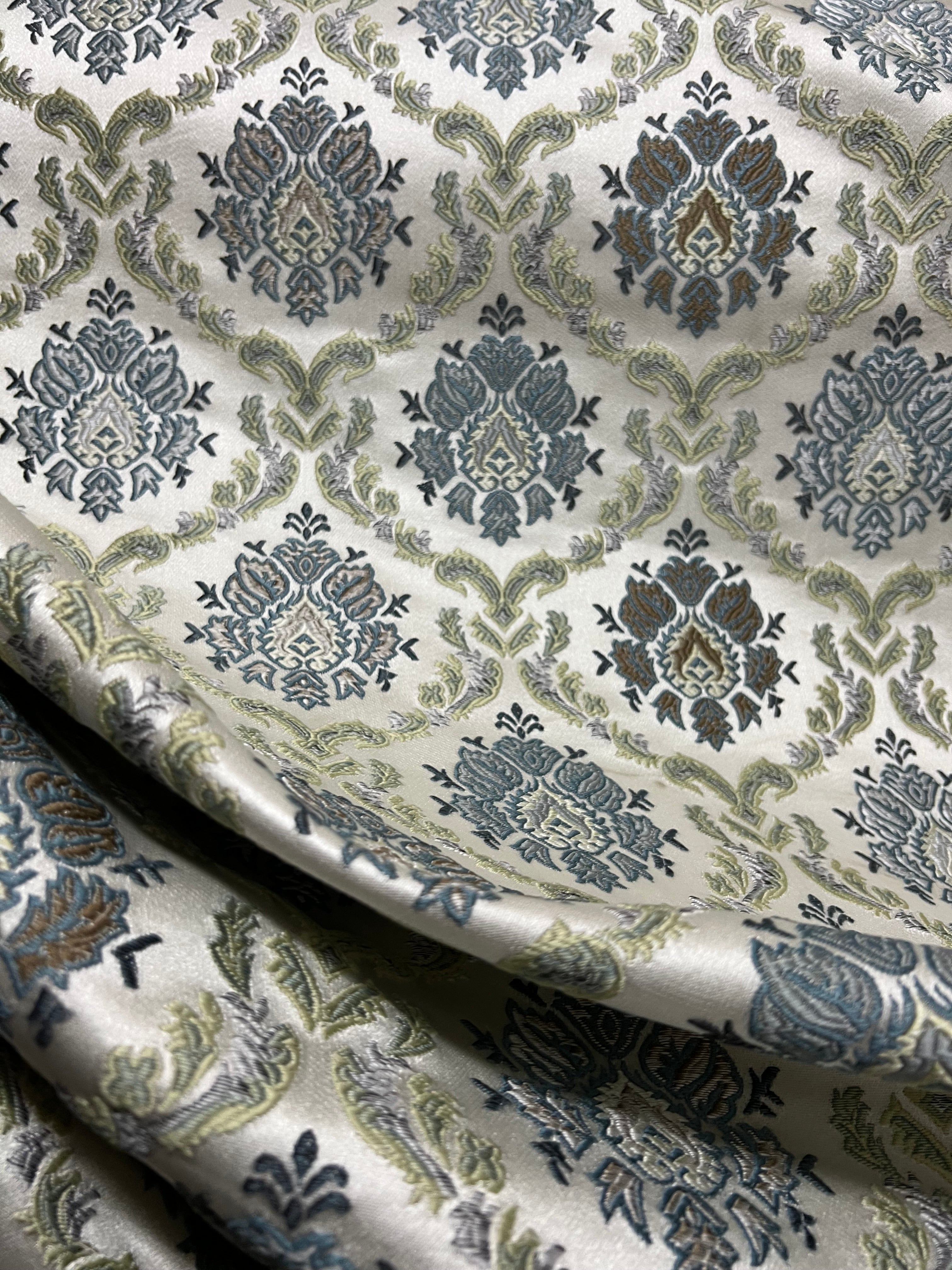 Decorative fabric with intricate Blue floral pattern on a beige background