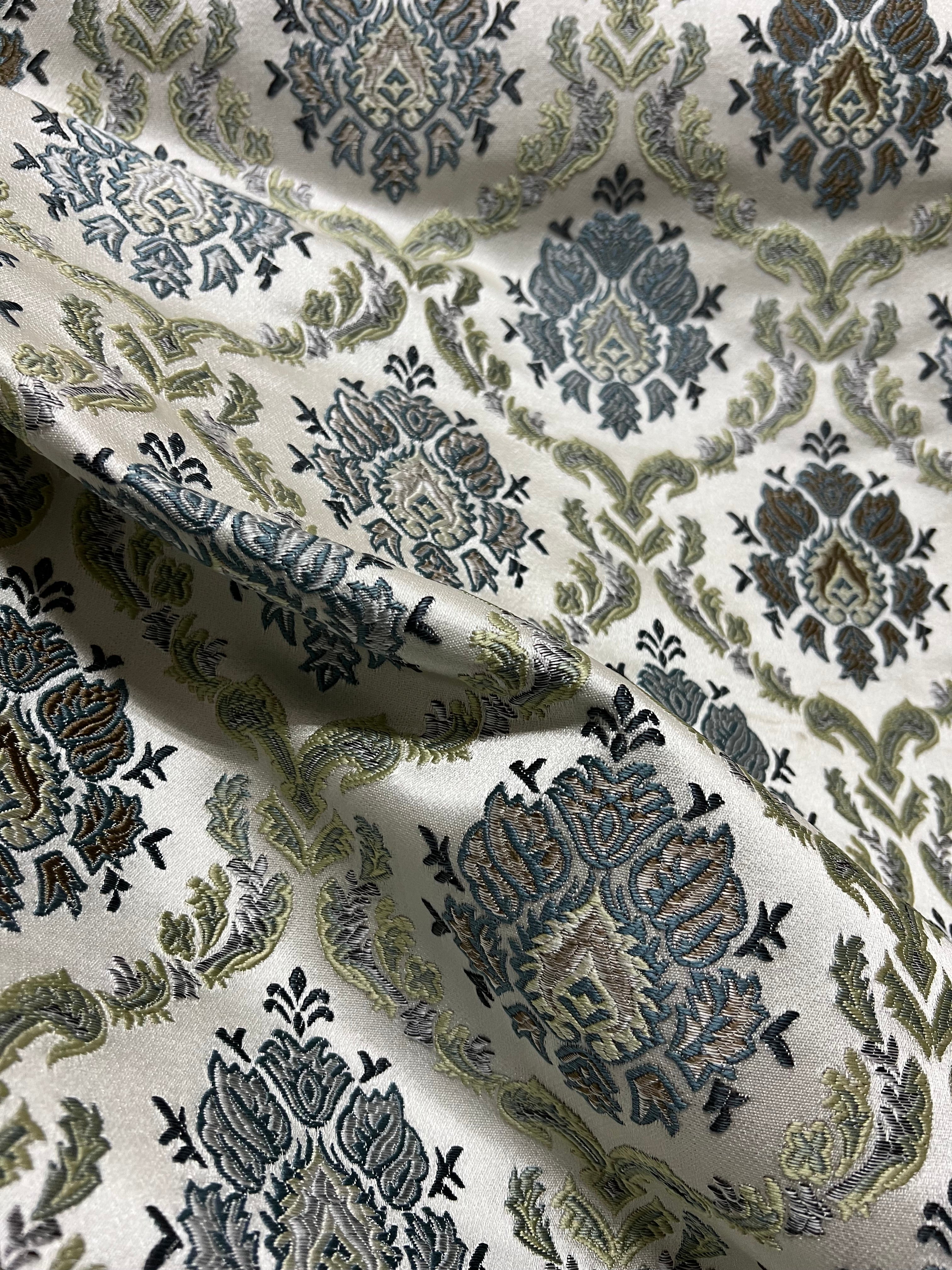 Decorative fabric with intricate Blue floral pattern on a beige background