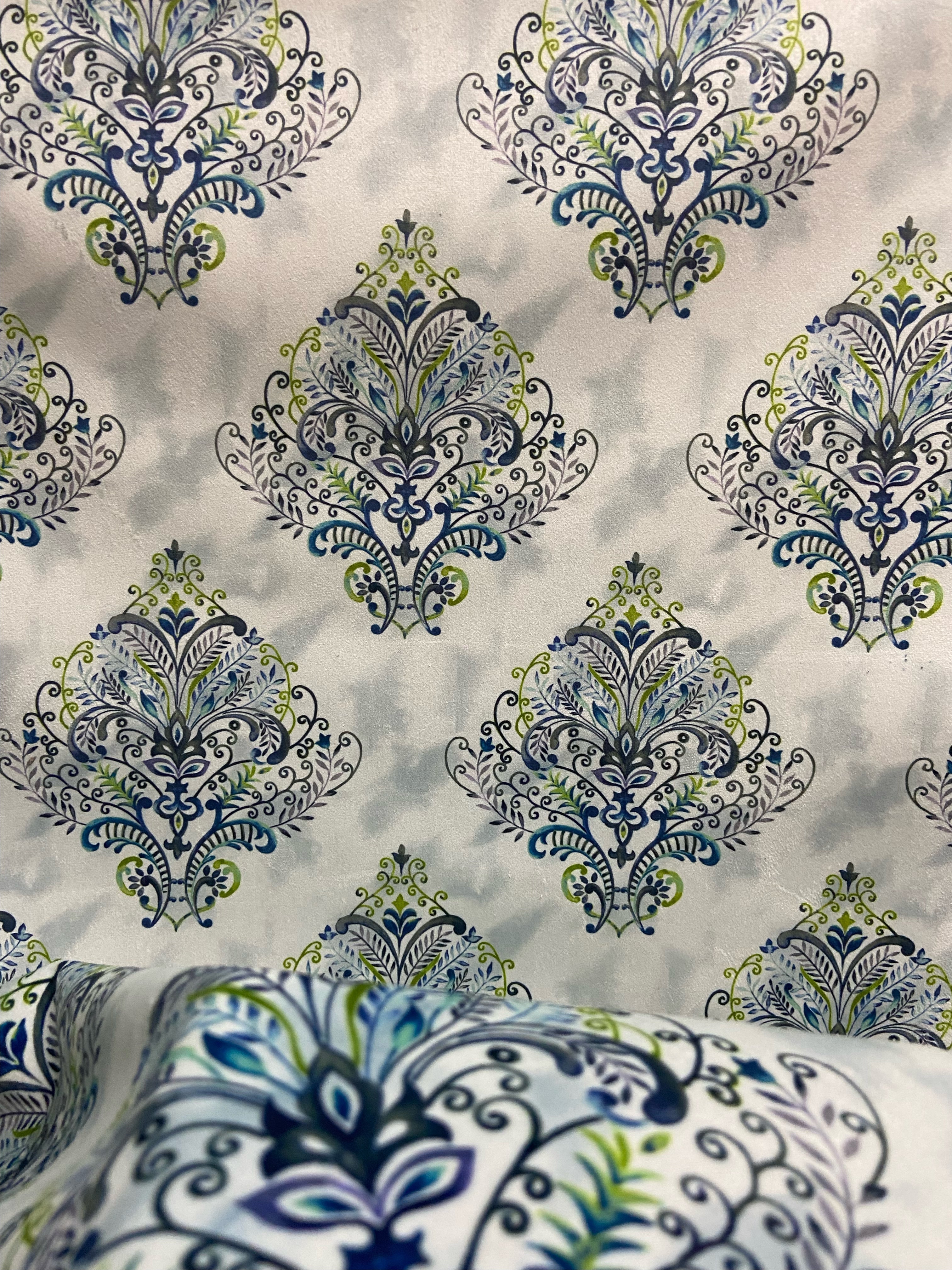 Decorative fabric pattern with Blue designs on a taupe background