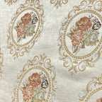 Decorative fabric with floral embroidery and intricate pattern such as Victorian Mirror Floral on an Antique White background