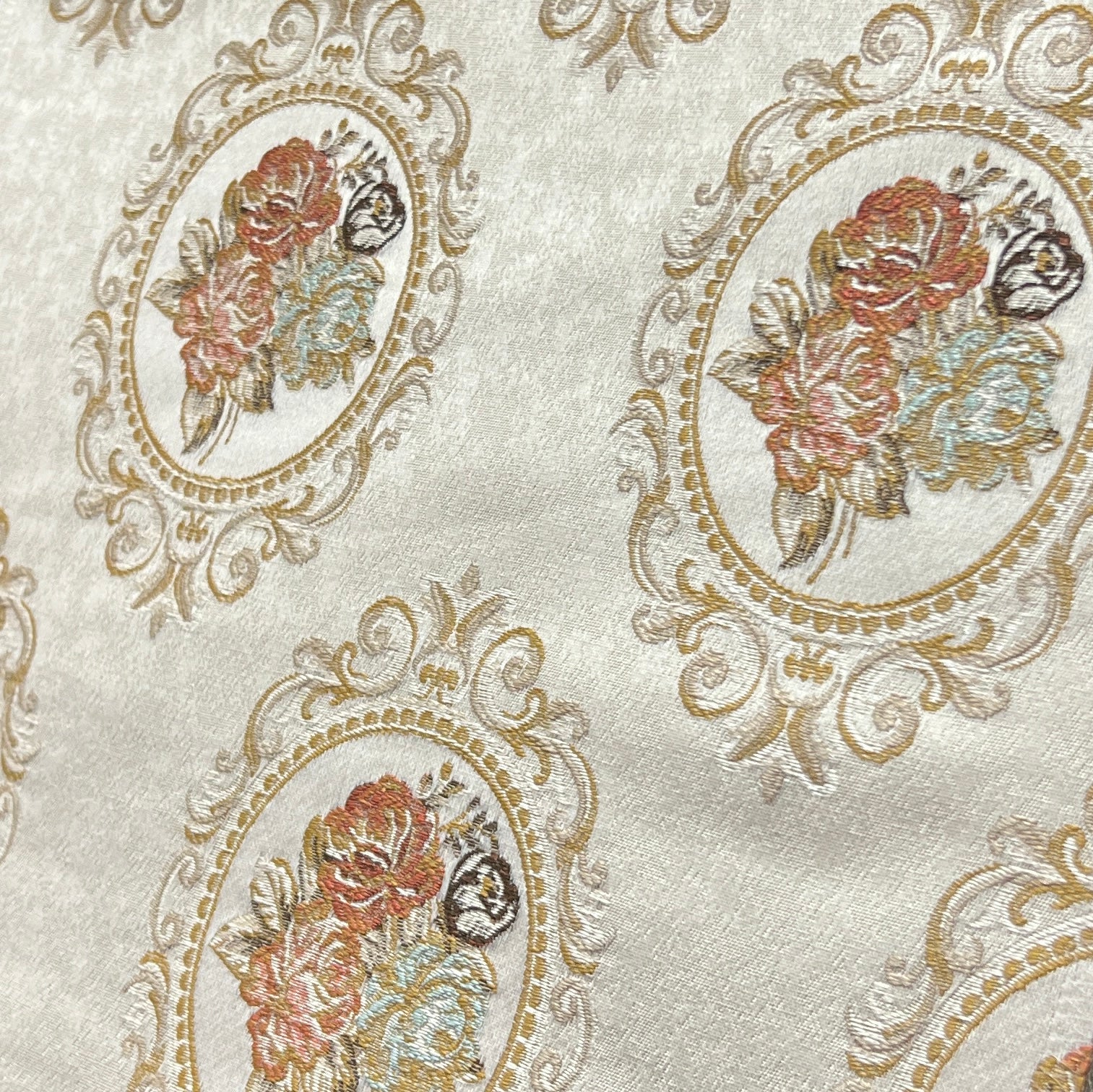 Decorative fabric with floral embroidery and intricate pattern such as Victorian Mirror Floral on an Antique White background
