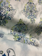 Decorative fabric pattern with Blue designs on a taupe background