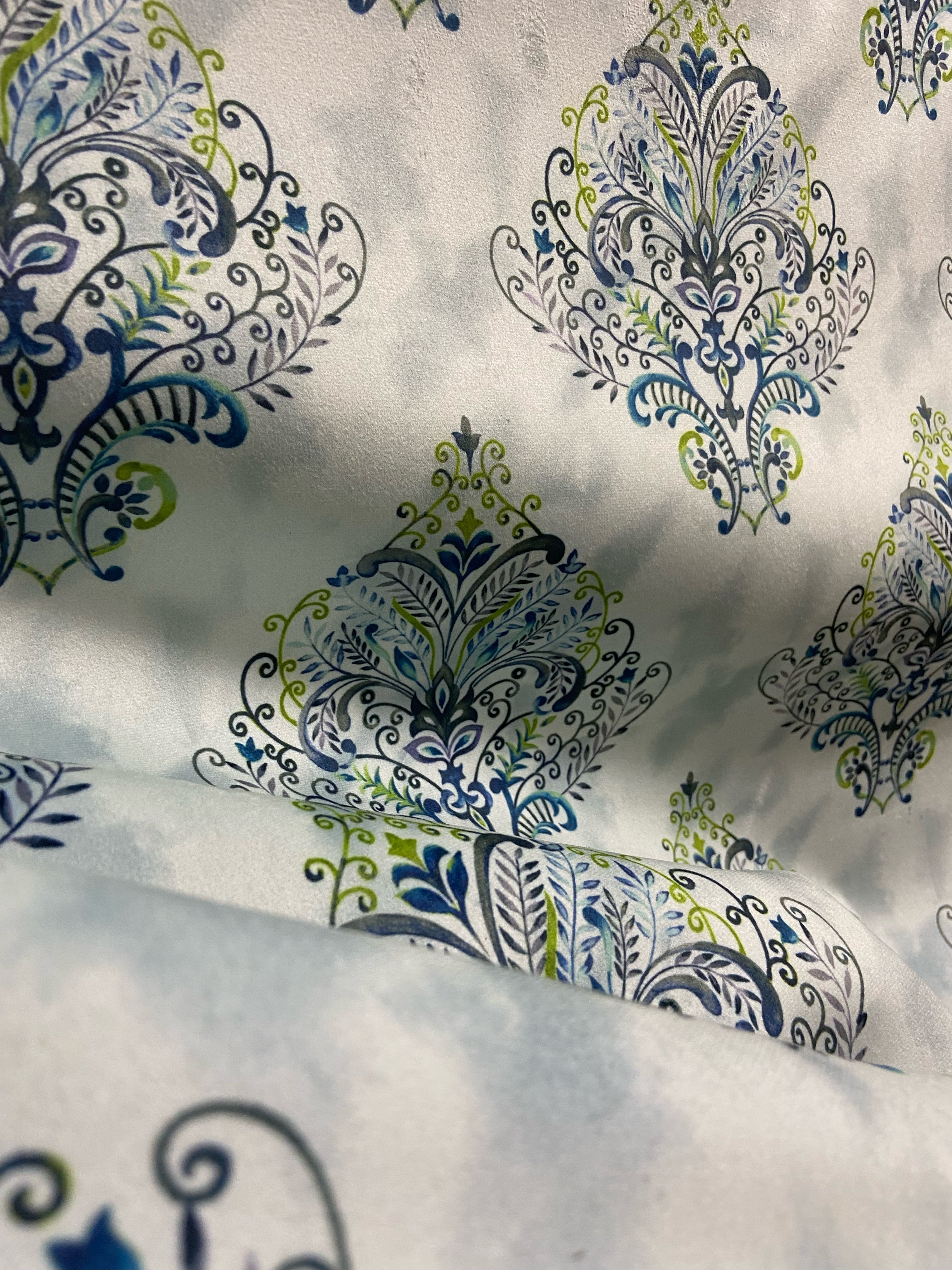 Decorative fabric pattern with Blue designs on a taupe background