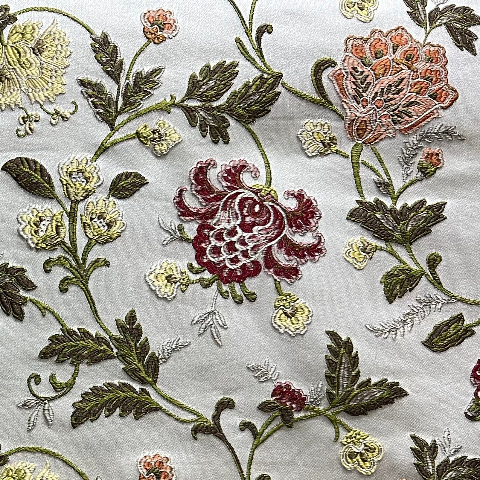Embroidered Red floral pattern on fabric