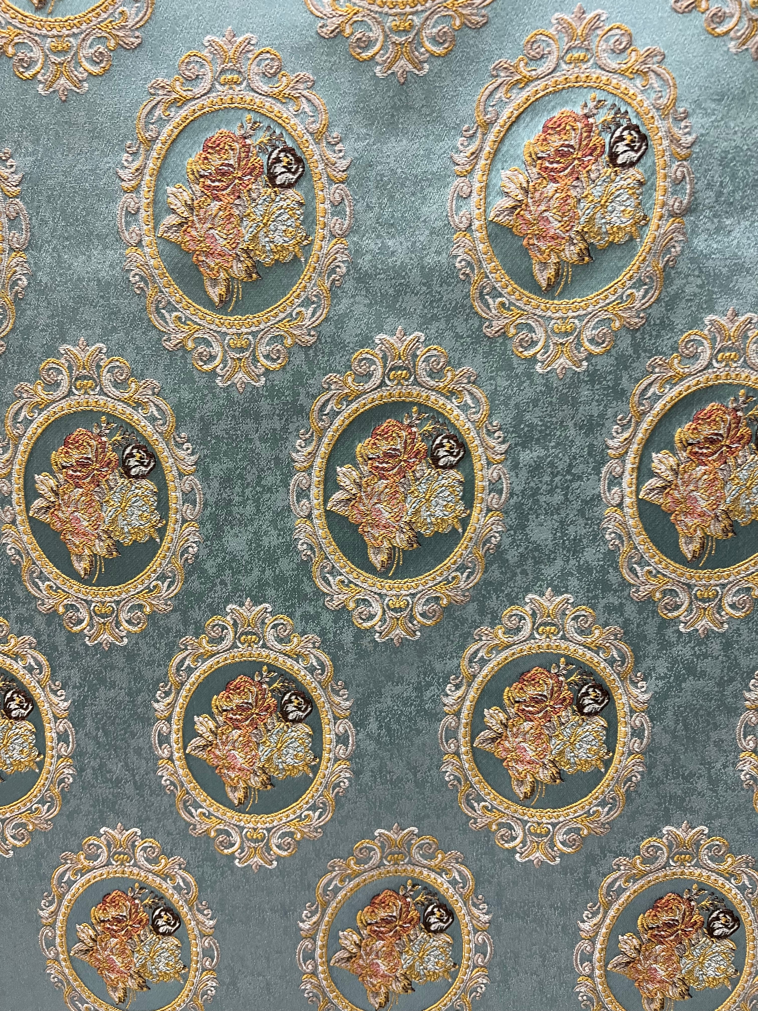 Decorative fabric with floral embroidery and intricate pattern such as Victorian Mirror Floral on an Teal Blue background