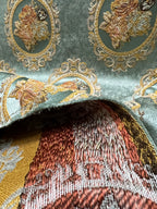 Decorative fabric with floral embroidery and intricate pattern such as Victorian Mirror Floral on an Teal Blue background