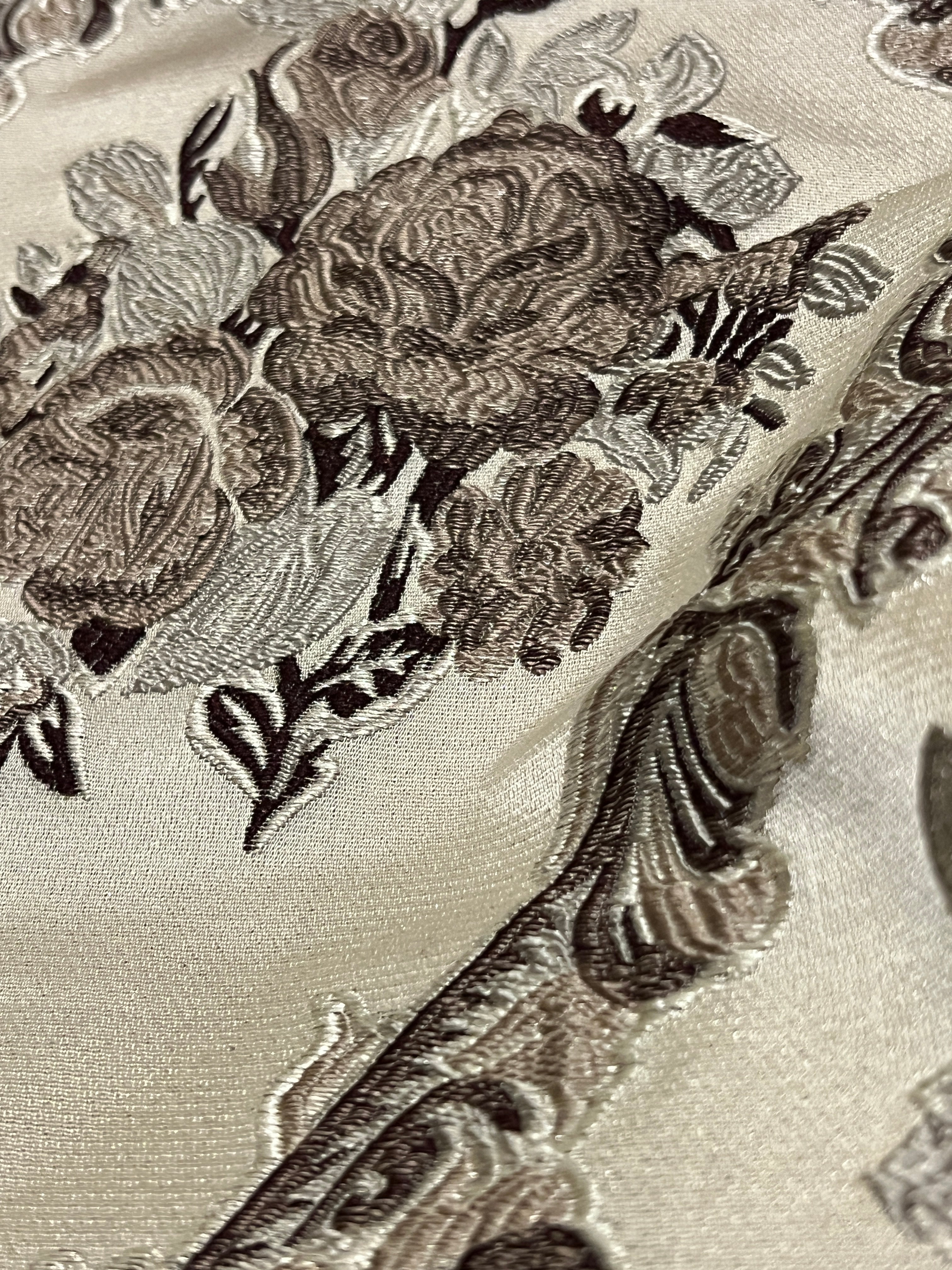 Decorative floral and baroque damask pattern on a beige background with Brown design
