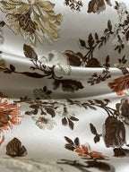 Floral pattern with Gold and brown flowers on a light background