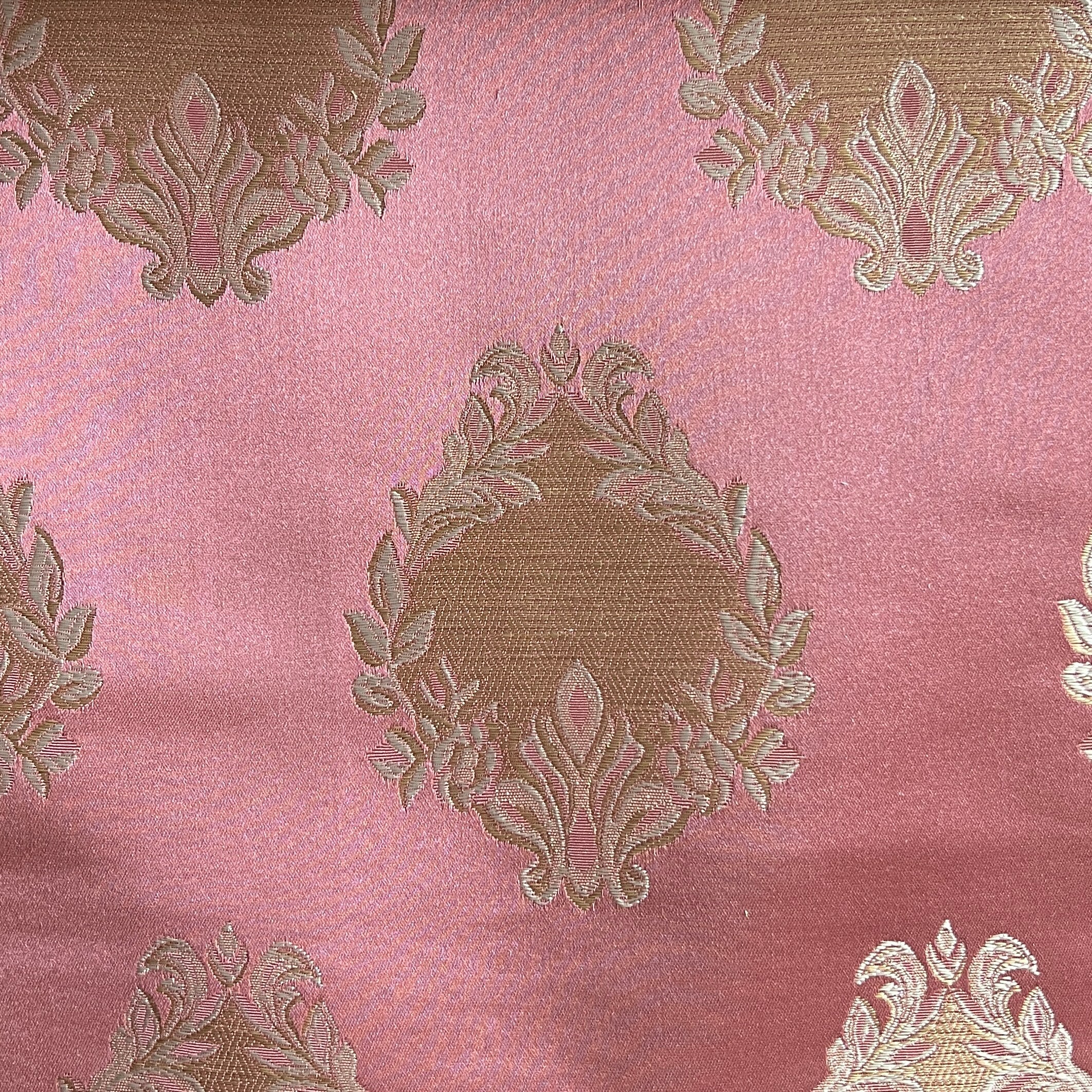 Decorative fabric pattern with intricate white designs on a Rosewood background