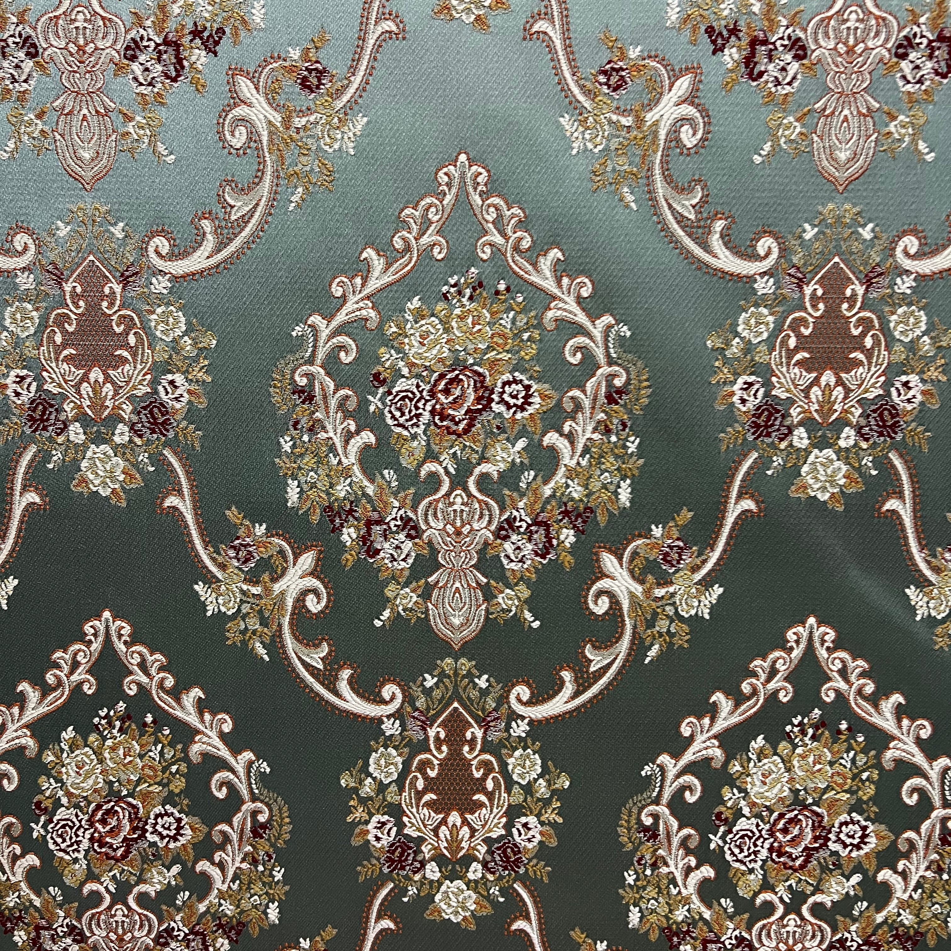 Decorative fabric with intricate floral damask on Teal Blue background
