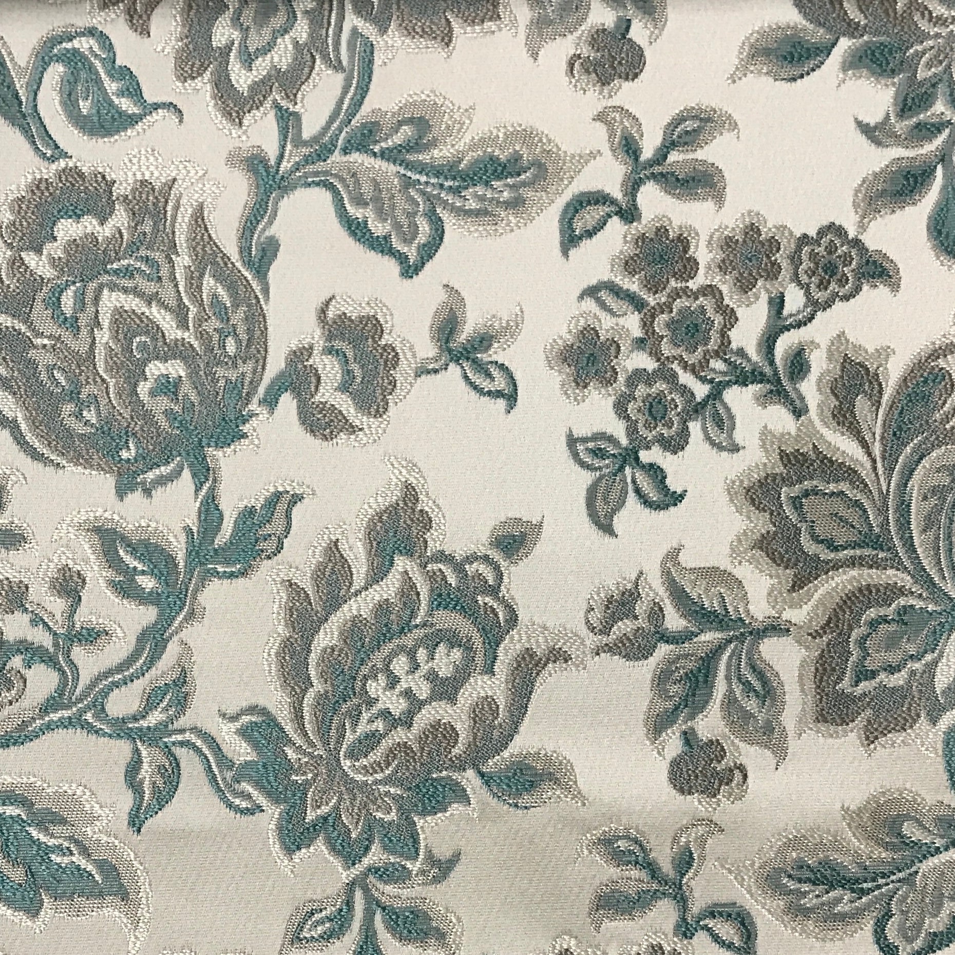 Sapphire blue floral jacquard upholstery fabric by the yard, close-up pattern view.