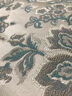 Sapphire blue floral jacquard fabric swatch showing repeat pattern detail.