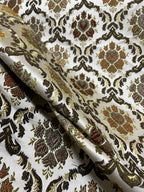 Decorative fabric with intricate Green floral pattern on a beige background