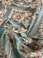 Decorative fabric with intricate floral damask on Teal Blue background