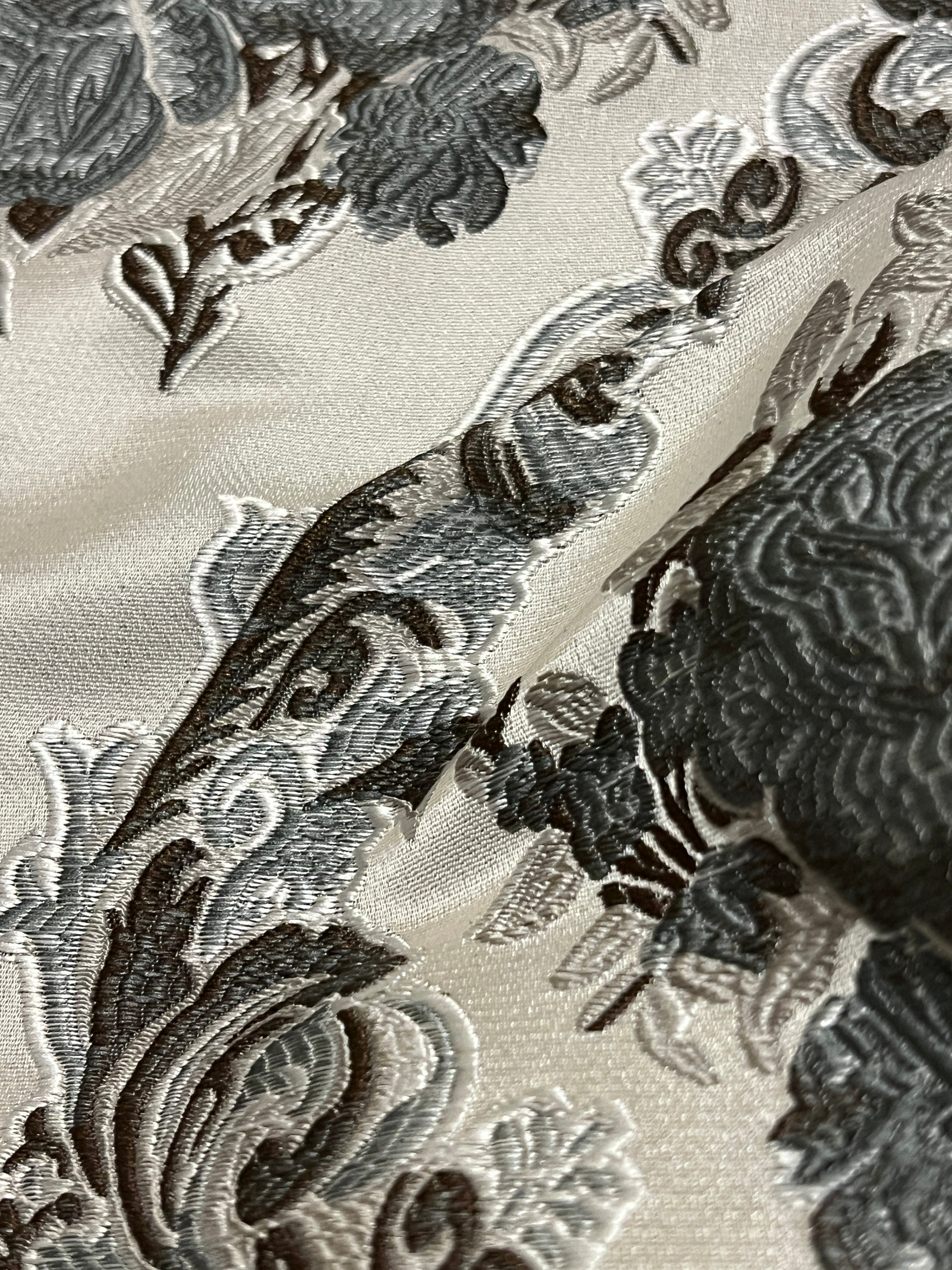 Decorative floral and baroque damask pattern on a beige background with Gray design