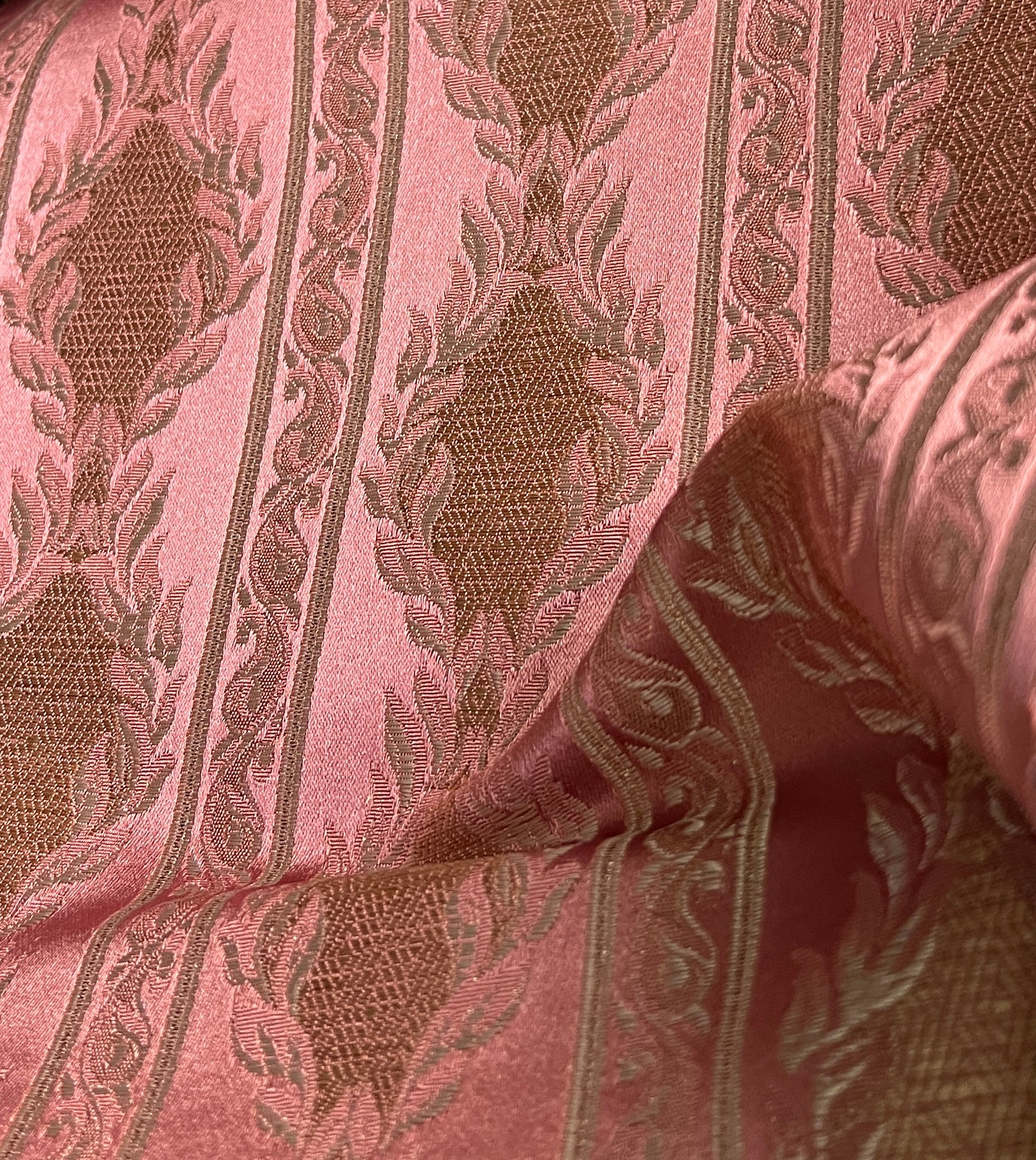 Decorative fabric with a stripe pattern on a Rosewood background