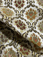 Decorative fabric with intricate Green floral pattern on a beige background