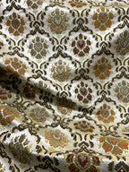 Decorative fabric with intricate Green floral pattern on a beige background