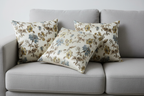 Floral pattern with Blue and brown flowers on a light background on cushion cover