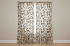 Embroidered Red floral pattern on fabric on curtain panels