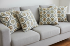 Decorative fabric with intricate Rust floral pattern on a beige background on cushion covers